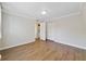 Bright bedroom with modern floors, white trim, and closet at 1948 Conway Rd # 8, Orlando, FL 32812
