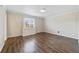 Well-lit bedroom with window and modern vinyl flooring at 1948 Conway Rd # 8, Orlando, FL 32812