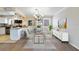 Elegant dining area adjacent to the kitchen with modern chandelier and stylish decor at 1948 Conway Rd # 8, Orlando, FL 32812