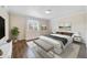 Serene bedroom with ample natural light, warm hardwood floors, and neutral decor at 1948 Conway Rd # 8, Orlando, FL 32812