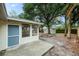 View of backyard featuring an open patio, shed and fire pit at 1957 Deloy Dr, Daytona Beach, FL 32119