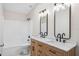 Bathroom featuring double sink vanity, marble countertops, black hardware and shower-tub combination at 1957 Deloy Dr, Daytona Beach, FL 32119