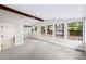 Spacious main bedroom featuring vaulted ceilings, natural light, updated flooring, and ensuite bathroom at 1957 Deloy Dr, Daytona Beach, FL 32119