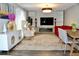 Well-decorated living room with patterned rug, accent chairs, and built-in shelving at 2381 Courtland Blvd, Deltona, FL 32738
