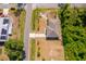 Aerial view of a home showcasing the roof, driveway, nearby houses and surrounding neighborhood at 2498 Iris Rd, Deland, FL 32724