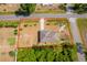 Aerial view of a single-Gathering home showing the property lines, landscaping, and neighborhood at 2498 Iris Rd, Deland, FL 32724