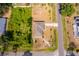 Birds eye view of a residential home highlighting its roof, driveway, landscape, and surrounding streets at 2498 Iris Rd, Deland, FL 32724