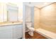 Bathroom with granite vanity, shower stall with tan tile and wood-look flooring at 2498 Iris Rd, Deland, FL 32724