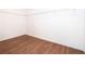 Spacious closet with wood floor, metal shelves and white walls at 2498 Iris Rd, Deland, FL 32724