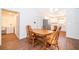 Dining room with wood table and chairs with access to kitchen and laundry room at 2498 Iris Rd, Deland, FL 32724