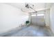 Clean garage with light gray door, white walls, and concrete floor at 2498 Iris Rd, Deland, FL 32724