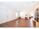 Bright living room features hardwood floors, front door, and bedroom access at 2498 Iris Rd, Deland, FL 32724