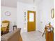Bright entryway with a decorative front door, and neutral-colored walls at 254 Oak Park Pl, Casselberry, FL 32707