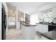 Open-concept kitchen featuring an island and views into adjacent rooms, creating a spacious atmosphere at 254 Oak Park Pl, Casselberry, FL 32707