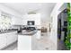 Bright kitchen featuring white cabinetry, stainless steel appliances, and an open layout at 254 Oak Park Pl, Casselberry, FL 32707