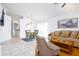Open-concept living and dining area with tile floors and a comfortable sofa at 254 Oak Park Pl, Casselberry, FL 32707