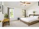 Serene main bedroom with lots of natural light, carpet floors, and ample space at 254 Oak Park Pl, Casselberry, FL 32707