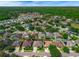 Aerial view of a residential neighborhood with tree-lined streets and well-maintained homes at 2643 University Acres Dr, Orlando, FL 32817