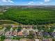 Beautiful aerial view of the homes and the large greenspace in the community at 2643 University Acres Dr, Orlando, FL 32817