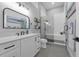 Contemporary bathroom with sleek vanity, black fixtures, a glass-enclosed shower, and modern decor at 2643 University Acres Dr, Orlando, FL 32817