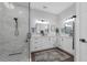 Modern bathroom with double vanity, granite countertops, black fixtures, and luxurious glass enclosed shower at 2643 University Acres Dr, Orlando, FL 32817