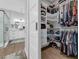 Spacious walk-in closet with custom shelving, hanging rods, and organization for clothing and accessories at 2643 University Acres Dr, Orlando, FL 32817
