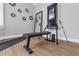 Functional home gym with modern exercise equipment, a full-length mirror, and ample workout space at 2643 University Acres Dr, Orlando, FL 32817