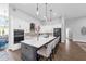 Modern kitchen with a large center island, stainless steel appliances, and sleek white cabinetry at 2643 University Acres Dr, Orlando, FL 32817