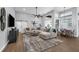 Spacious living room with high ceilings, comfortable seating, and access to outdoor living spaces at 2643 University Acres Dr, Orlando, FL 32817