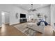 Bright and airy living room featuring a comfortable sectional sofa, modern decor, and ample natural light at 2643 University Acres Dr, Orlando, FL 32817