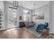 Elegant living room with high ceilings, stylish furnishings, and an abundance of natural light at 2643 University Acres Dr, Orlando, FL 32817