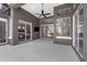 An open patio featuring a ceiling fan, with sliding glass doors leading to rooms inside the home at 2643 University Acres Dr, Orlando, FL 32817