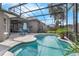 Backyard pool with patio area and seating surrounded by a screened enclosure at 2643 University Acres Dr, Orlando, FL 32817