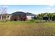 Expansive backyard offers a screened lanai and plenty of space for outdoor activities at 2941 Marlberry Ln, Clermont, FL 34714