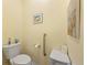 Bathroom featuring toilet, safety bar and neutral walls at 2941 Marlberry Ln, Clermont, FL 34714