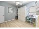 Bright bedroom offering a murphy bed with a desk, chair and stylish accents at 2941 Marlberry Ln, Clermont, FL 34714