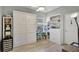 A versatile bedroom features a stylish murphy bed, desk, and ample storage at 2941 Marlberry Ln, Clermont, FL 34714