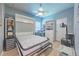 Open murphy bed, showcasing a mattress, along with shelves and drawers in a room at 2941 Marlberry Ln, Clermont, FL 34714