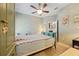 Comfortable bedroom featuring an ornamental wardrobe with access to a modern kitchen at 2941 Marlberry Ln, Clermont, FL 34714
