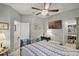 Lovely bedroom featuring a wardrobe, a ceiling fan, and a wall-mounted TV at 2941 Marlberry Ln, Clermont, FL 34714
