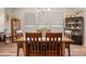Inviting dining room with wooden table and chairs, complemented by elegant furnishings and soft natural light at 2941 Marlberry Ln, Clermont, FL 34714