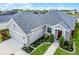 Charming single-story home with well-manicured landscaping, a two car garage, and a covered entryway at 2941 Marlberry Ln, Clermont, FL 34714