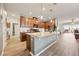 Gourmet kitchen features a large island and seamlessly connects to the living spaces at 2941 Marlberry Ln, Clermont, FL 34714
