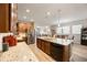 Modern kitchen with a large island, stainless steel appliances, and granite countertops at 2941 Marlberry Ln, Clermont, FL 34714