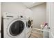 Functional laundry room featuring modern washer and dryer at 2941 Marlberry Ln, Clermont, FL 34714