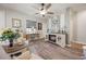 Bright and open living room with wood floors, fireplace, and stylish furniture at 2941 Marlberry Ln, Clermont, FL 34714