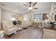 Inviting living room with stylish furnishings, wood floors, and natural light at 2941 Marlberry Ln, Clermont, FL 34714
