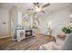 Bright living room featuring wood floors, a fireplace, and stylish furnishings at 2941 Marlberry Ln, Clermont, FL 34714