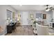 Bright living room with neutral walls and wood-look floors at 2941 Marlberry Ln, Clermont, FL 34714