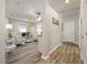 Open living area with comfortable seating, wood floors, and bright lighting at 2941 Marlberry Ln, Clermont, FL 34714